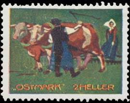 Bauer mit Frau und Kuhgespann beim Pflügen
