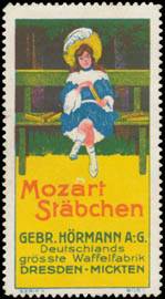 Kind mit Mozart Stäbchen